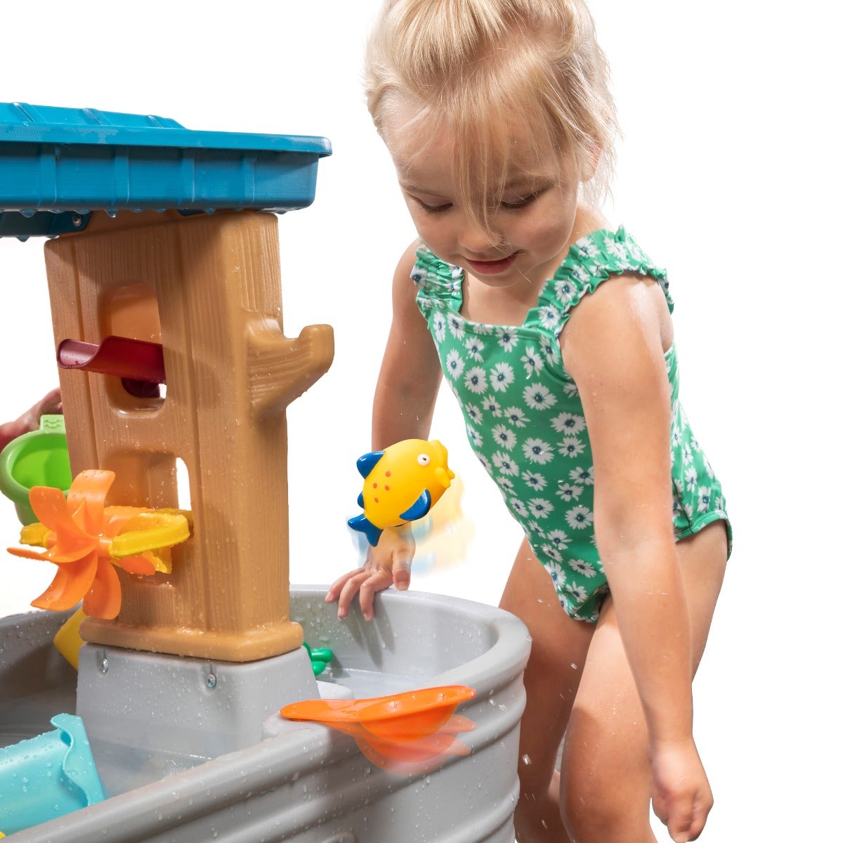 Rain Showers Splash Tub girl playing with flipper.