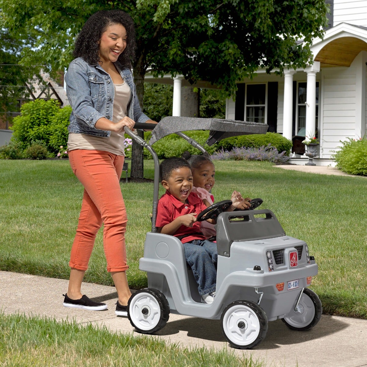 Side-By-Side Push Around SUV Gray with kids riding