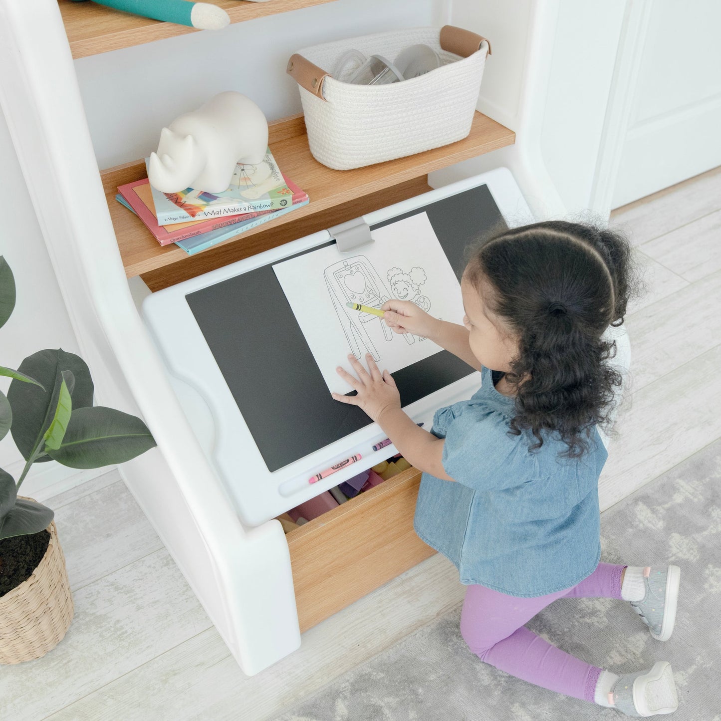 Harmony Toy Box with child coloring on board