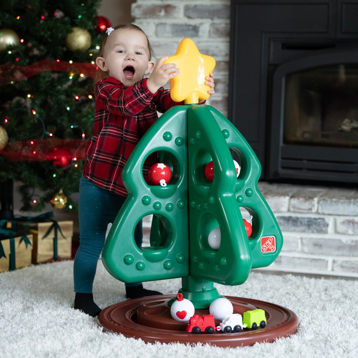 My First Christmas Tree™ with Red & White Ornaments child independently placing star