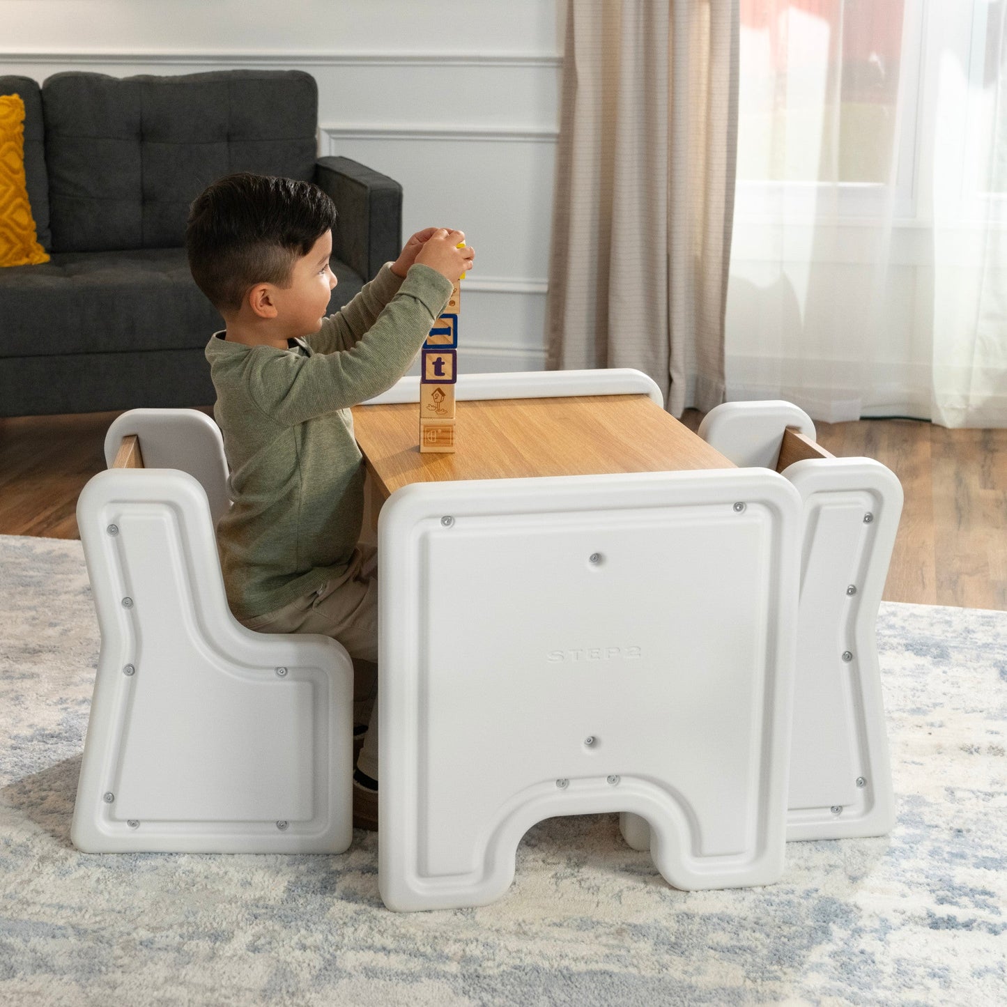 Harmony Table and Chairs™ with boy playing at table