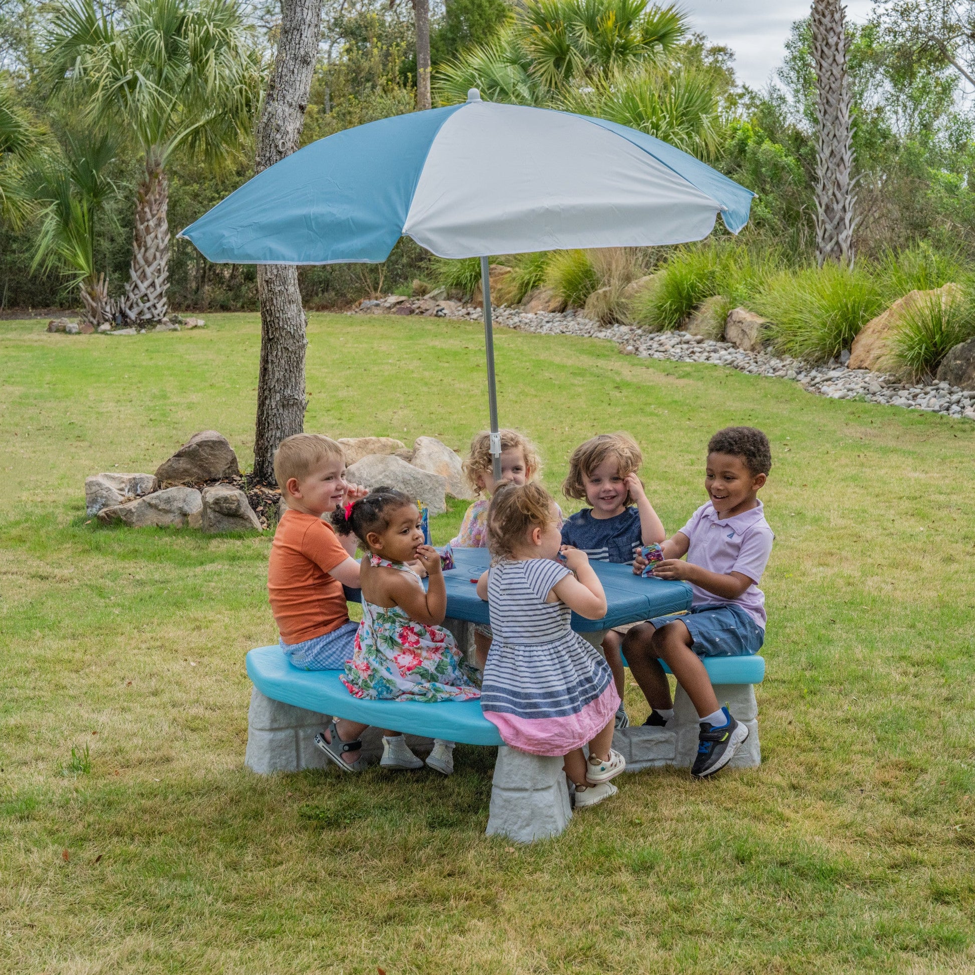 Sun & Fun Picnic Table with Umbrella™ with children socializing