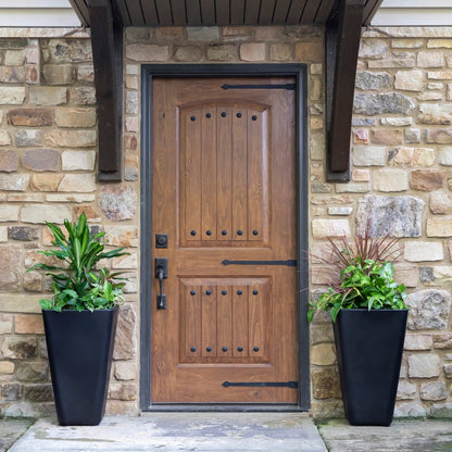 Bridgeview Tall Planter displayed on either side of a front door.