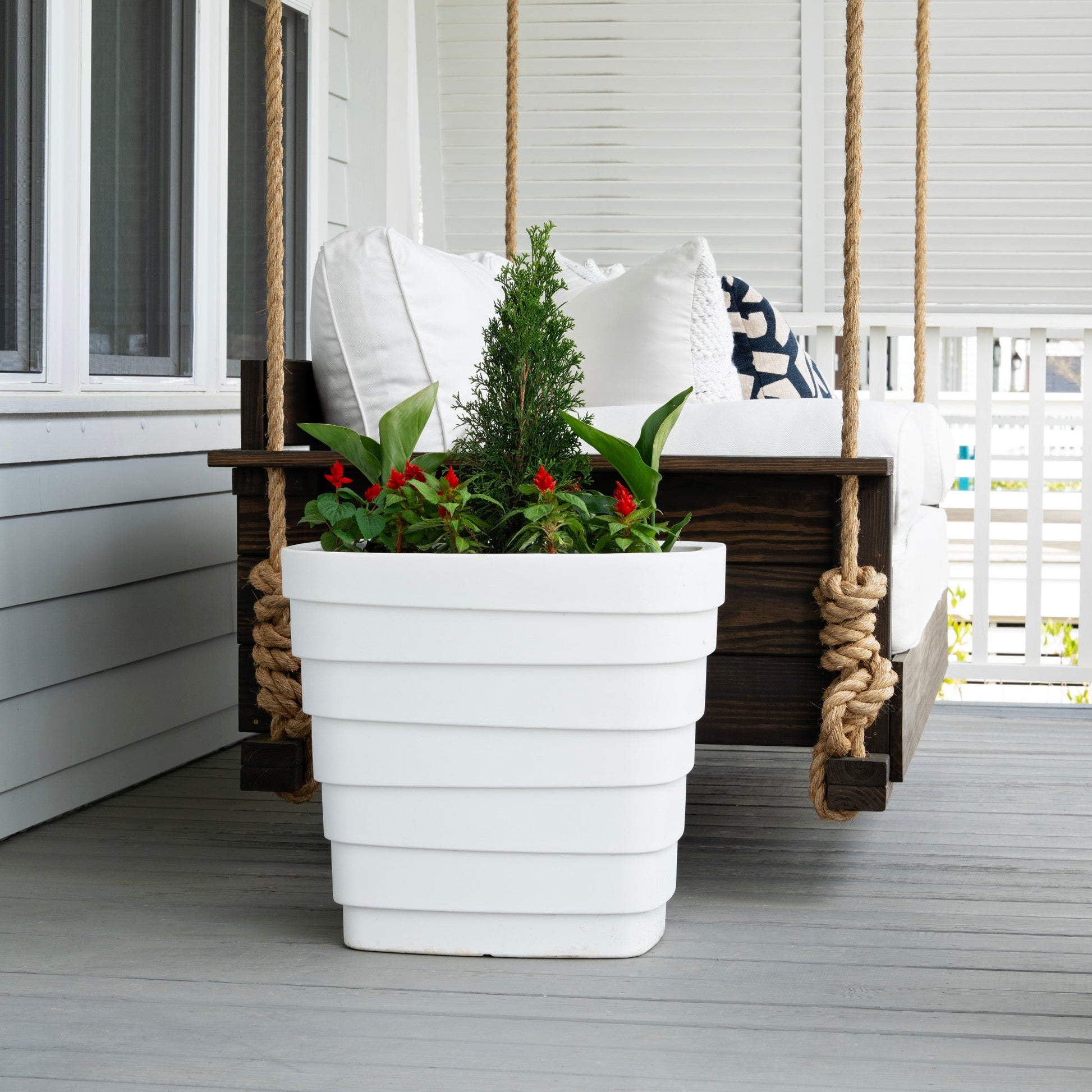 Wave Planter™ 20X24 White 2 Pack one shown with plants on porch