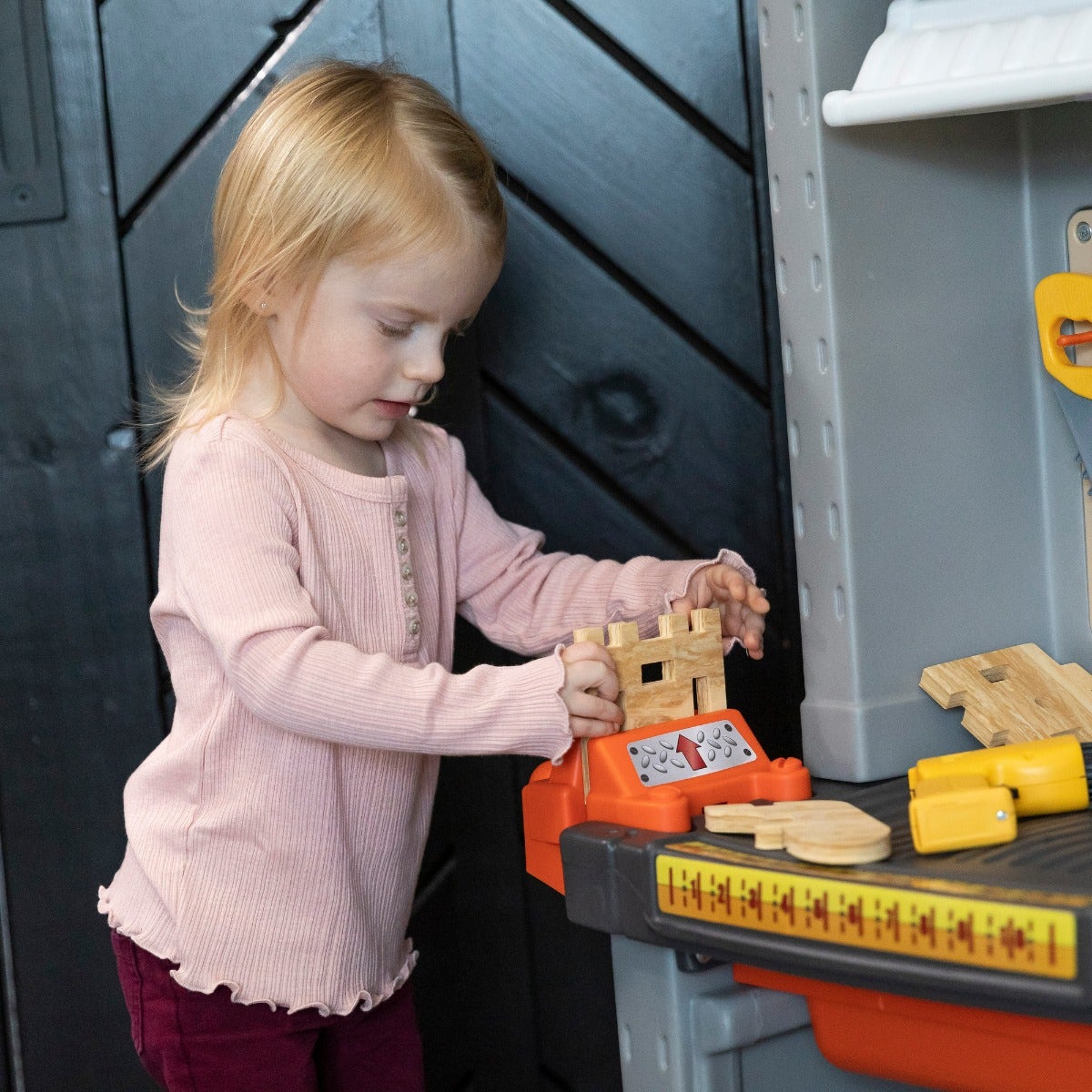 Deluxe Workshop girl building foam wood project.