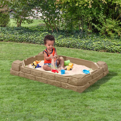 Naturally Playful™ Sandbox™ with child playing