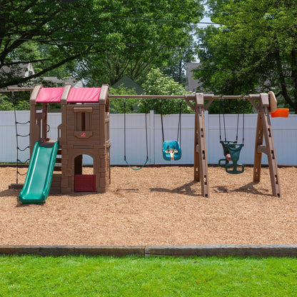 Infant to Toddler Swing™ - Teal attached to swing set