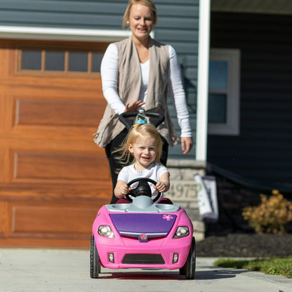 Whisper Ride II  - Pink woman pushing child.