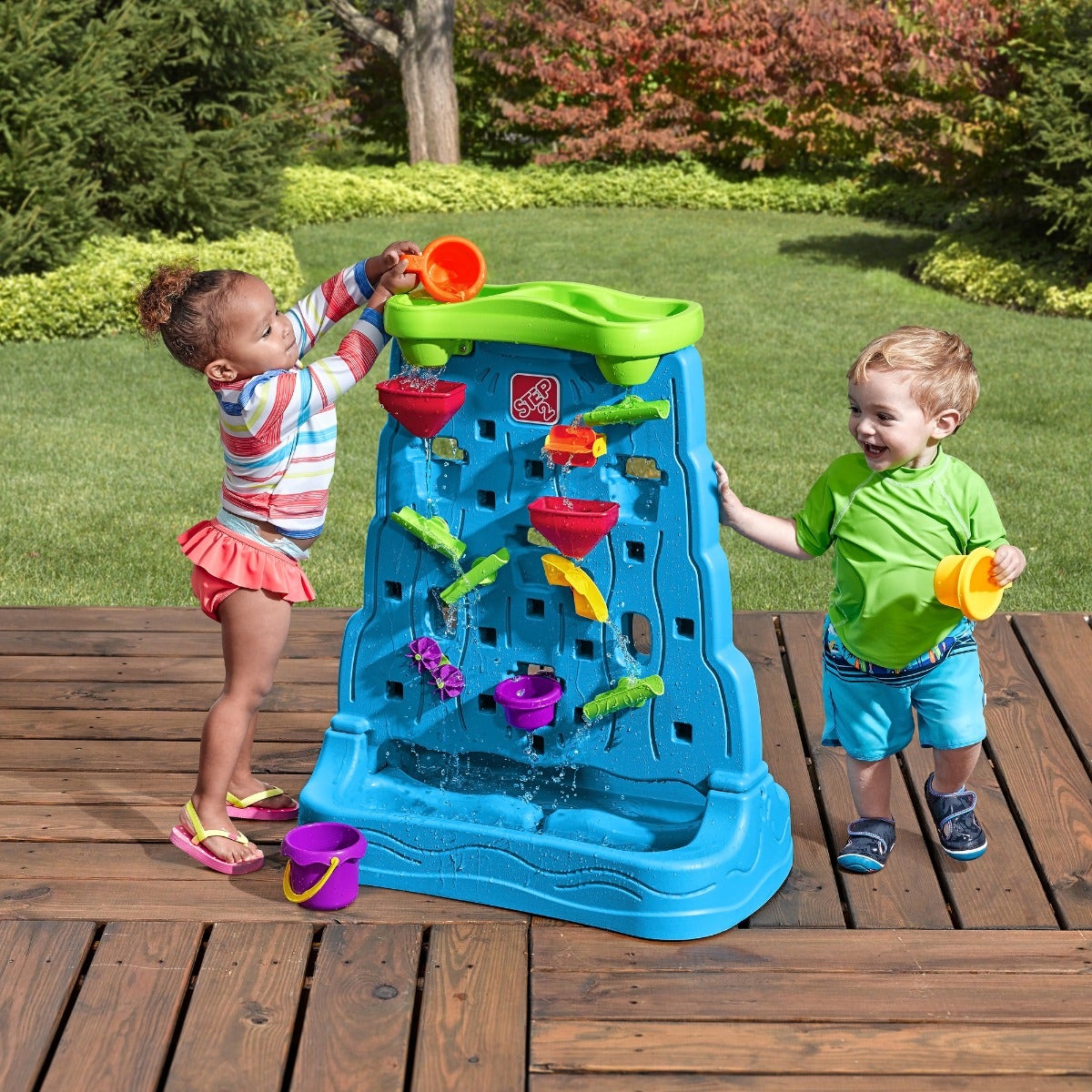 Waterfall Discovery Wall with kids playing outdoors